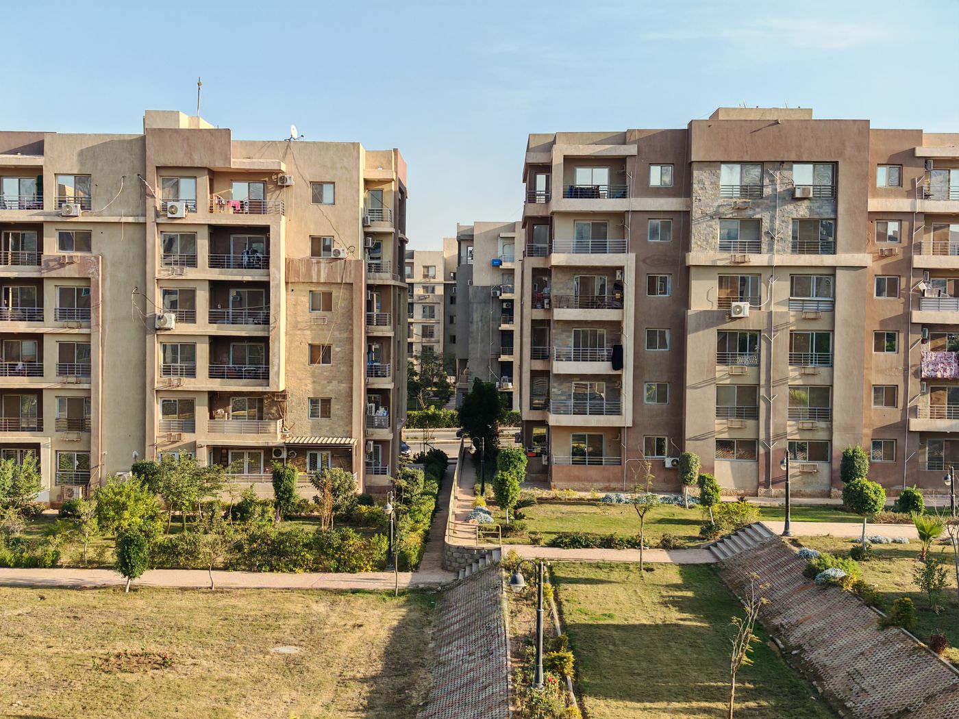 Residential estate buildings surrounded by trees